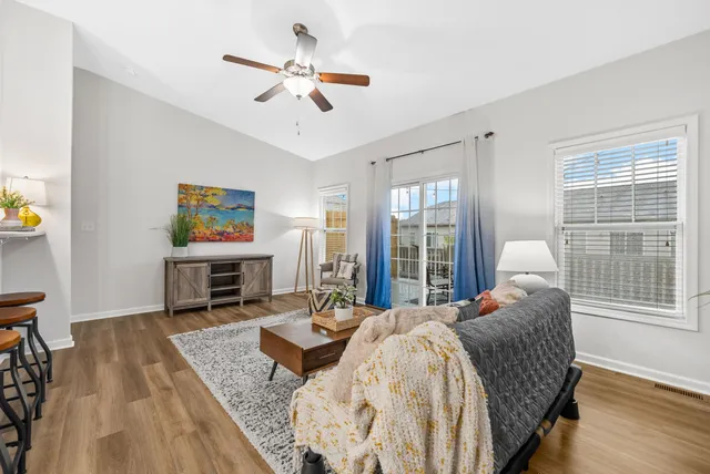 a bedroom with bed and a chair