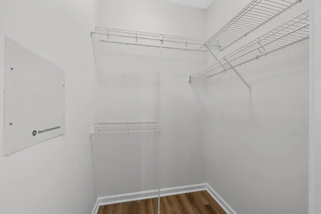 a view of a house with a yard and a fountain