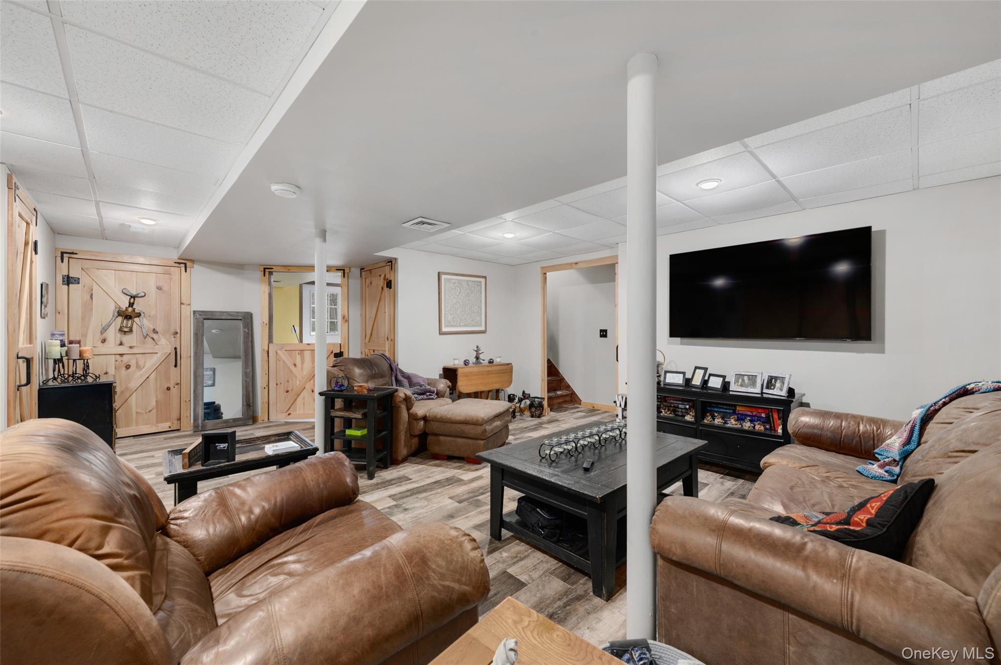 198 Hortontown Road Hopewell Junction, NY 12533 - Photo 23 of 36 a living room with furniture and a flat screen tv
