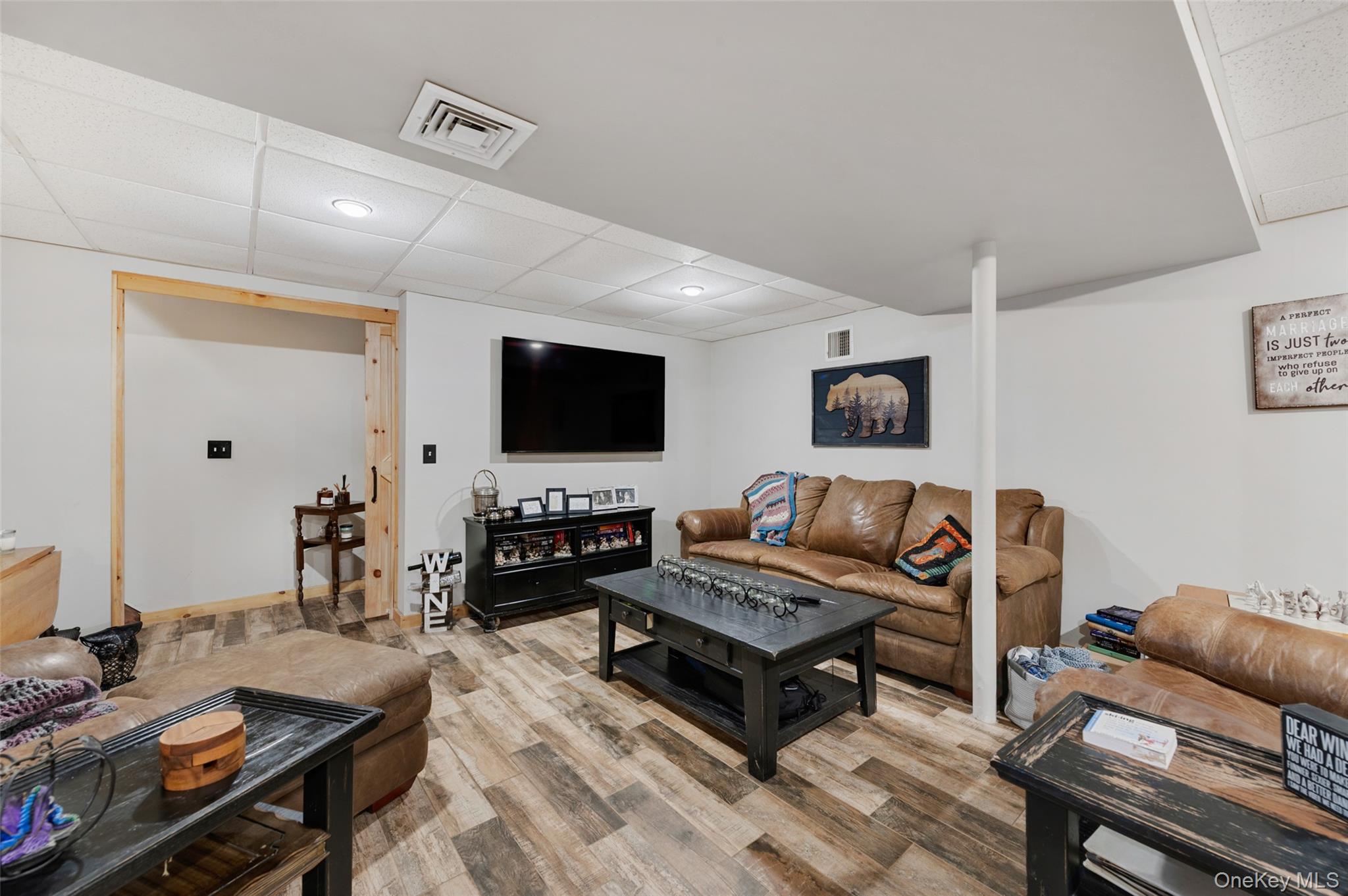 198 Hortontown Road Hopewell Junction, NY 12533 - Photo 24 of 36 a living room with furniture and a flat screen tv