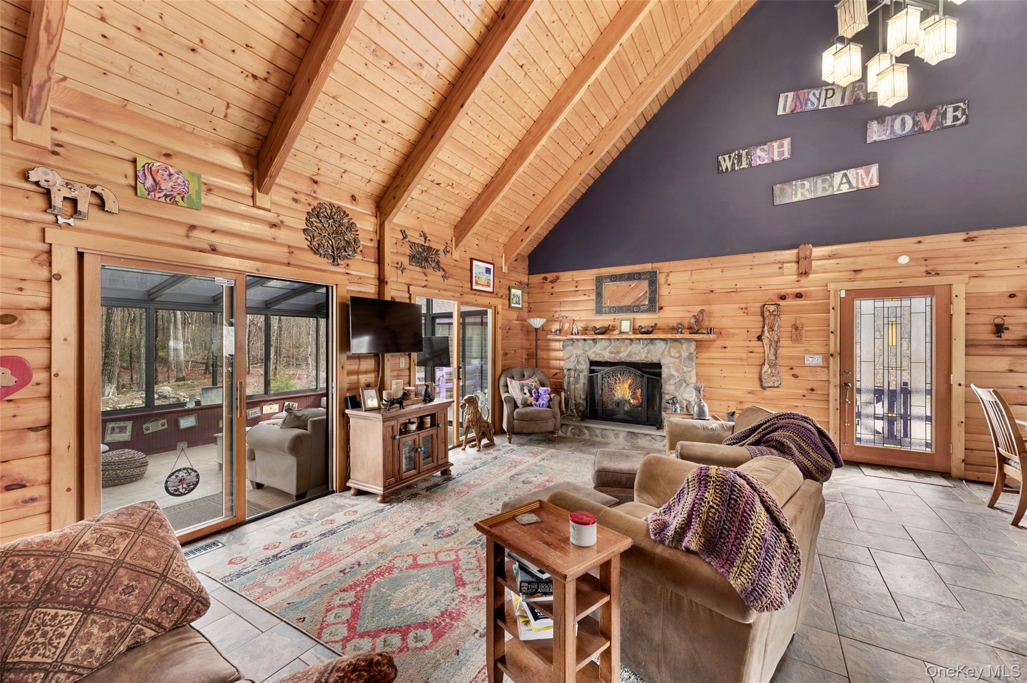 198 Hortontown Road Hopewell Junction, NY 12533 - Photo 7 of 36 a living room with furniture a fireplace and a flat screen tv