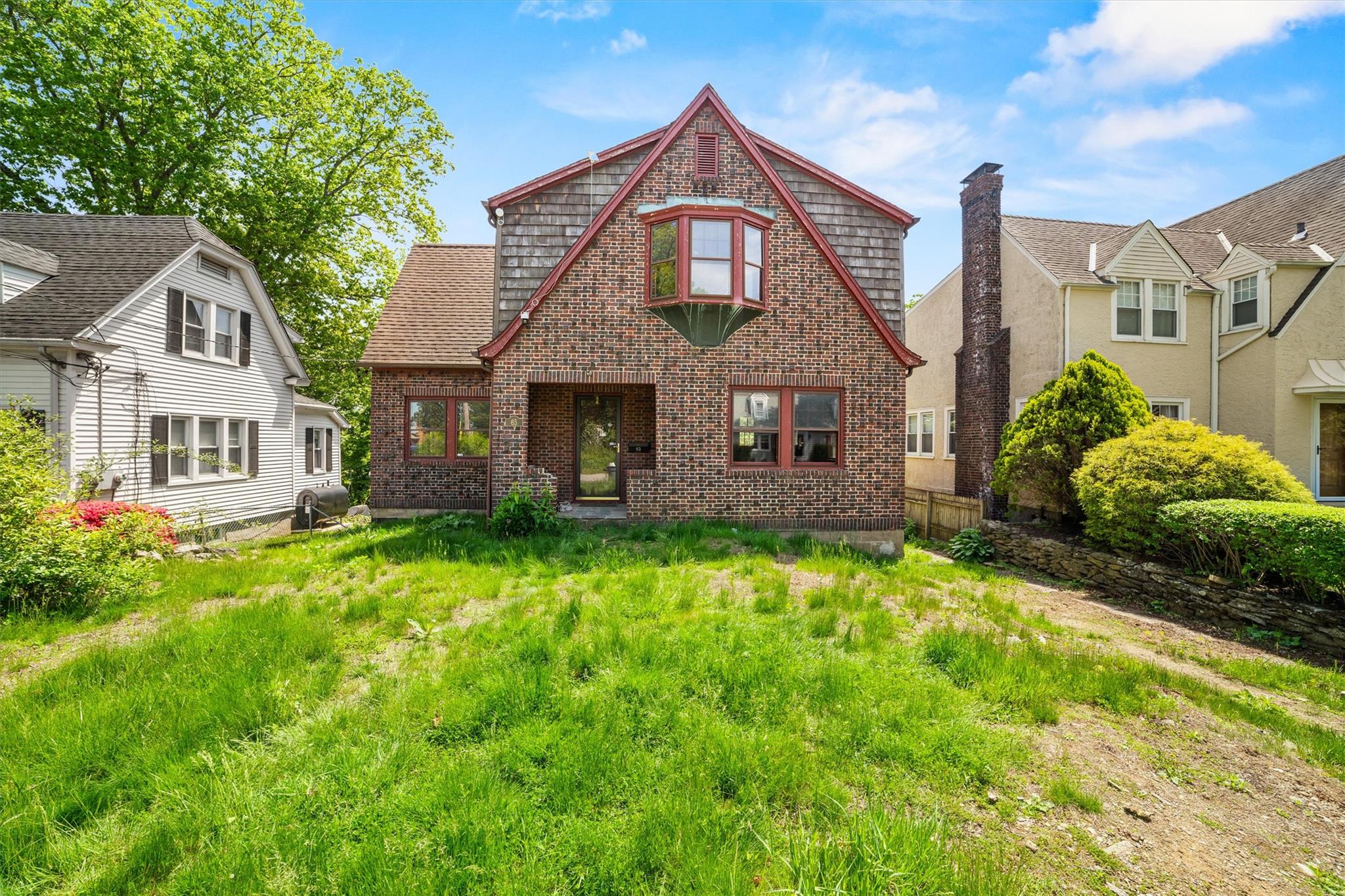 a front view of a house with a yard