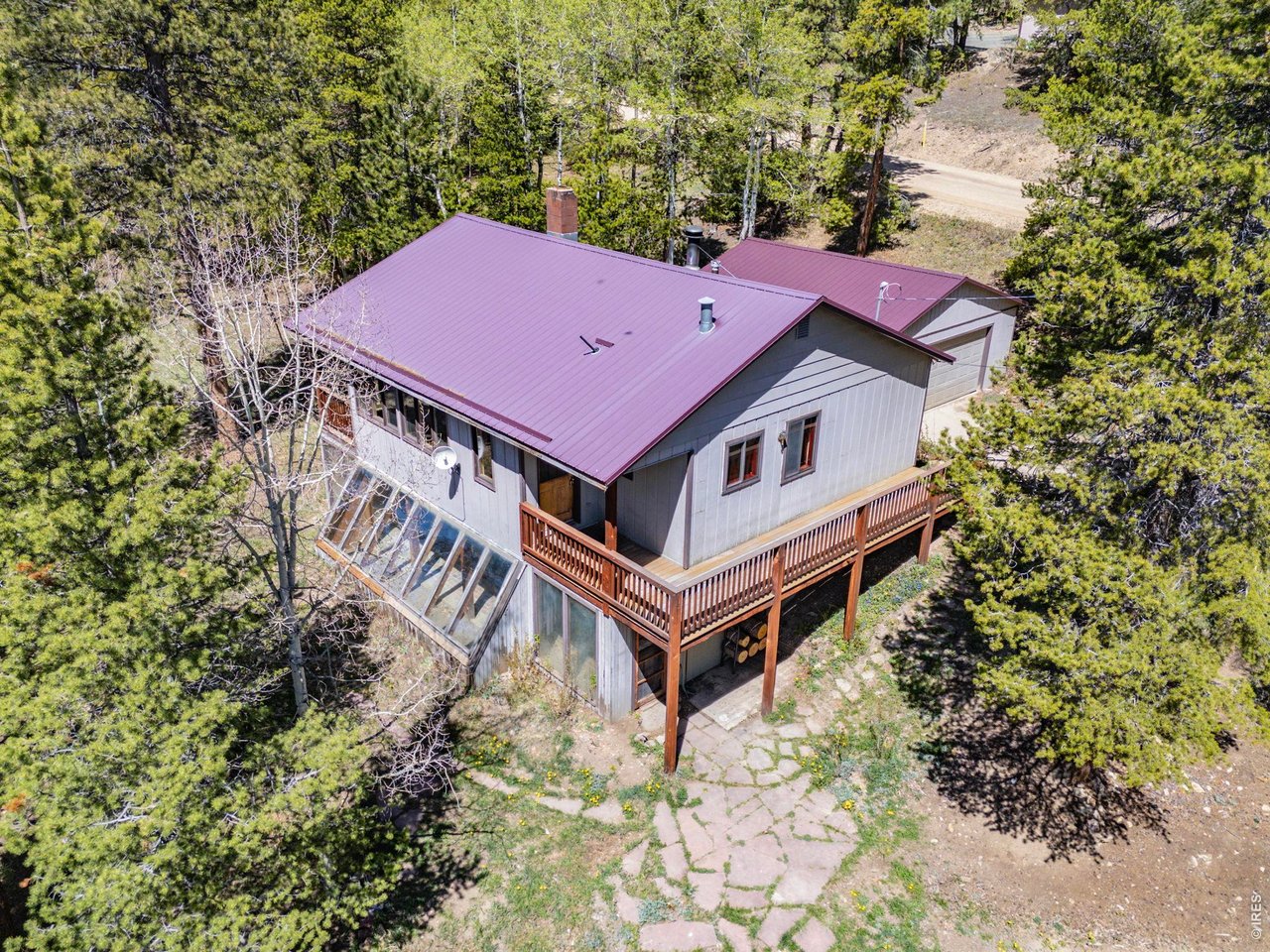 414 Upper Travis Gulch Road Black Hawk, CO 80422 - Photo 4 of 50 an aerial view of a house with a yard