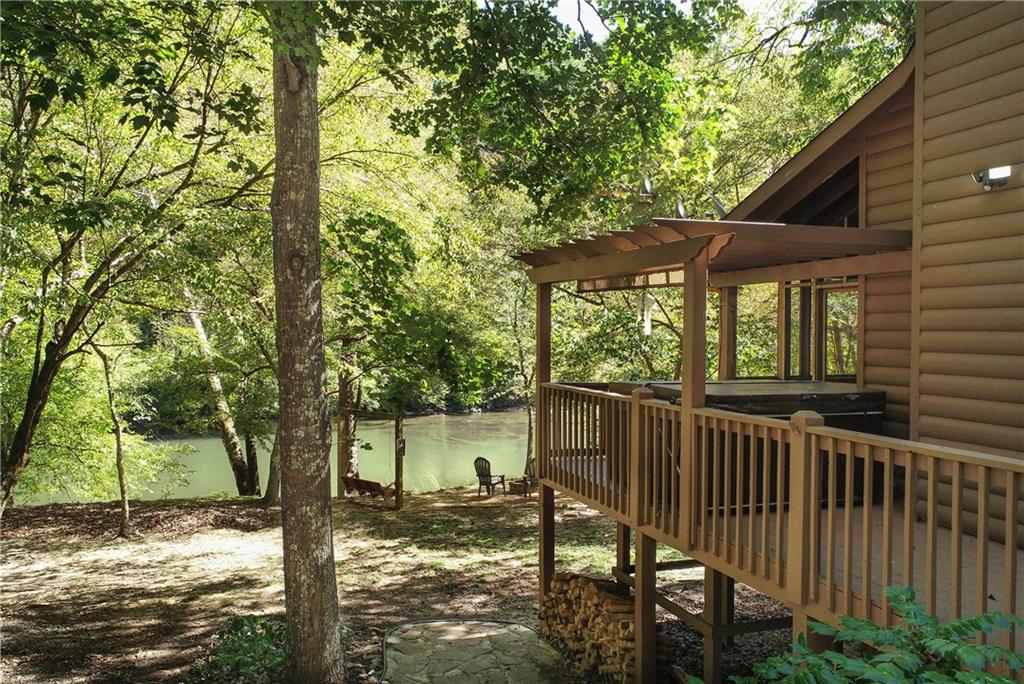 133 Muller Lane Ellijay, GA 30540 - Photo 1 of 1 a view of a house with backyard porch and sitting area