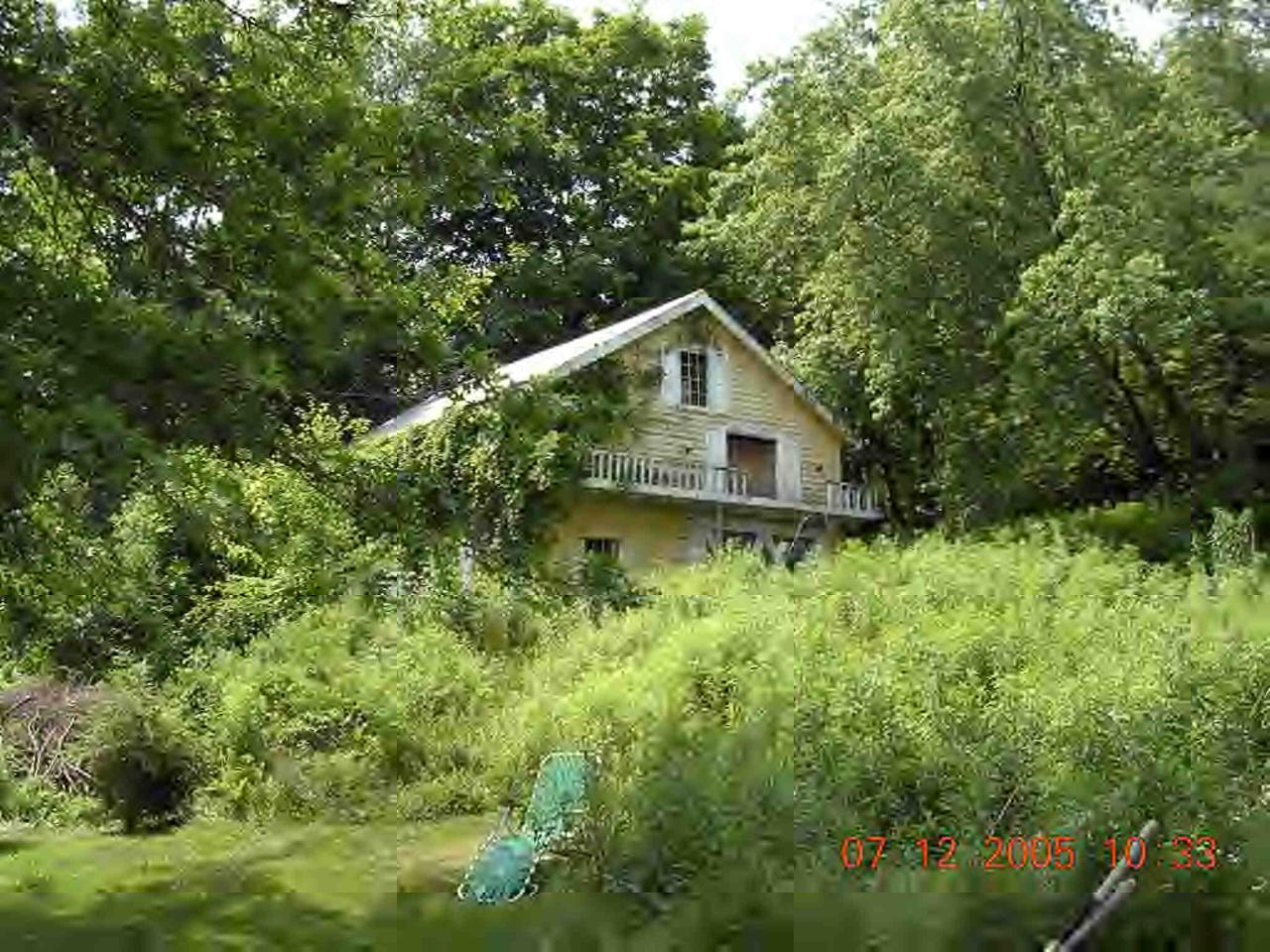 60 South Main Road Otis, MA 01253 - Photo 2 of 6 a house with a tree in front of it
