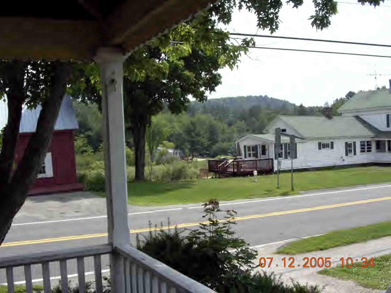 60 South Main Road Otis, MA 01253 - Photo 4 of 6 a front view of a house with a yard