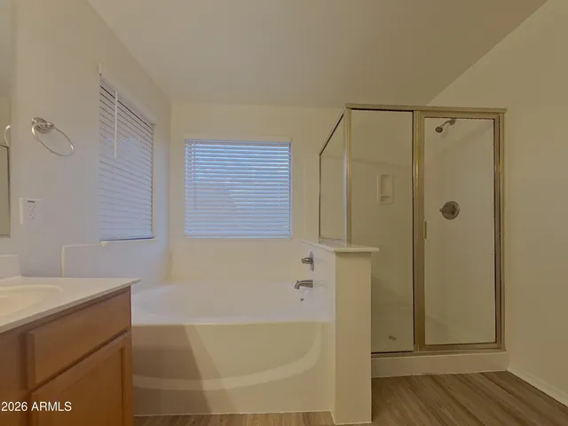 a bathroom with a sink a mirror and a light fixture