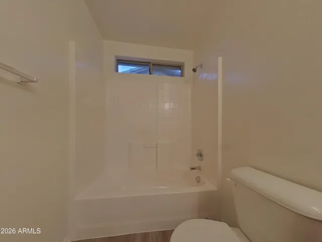 a bathroom with a sink a large mirror and vanity