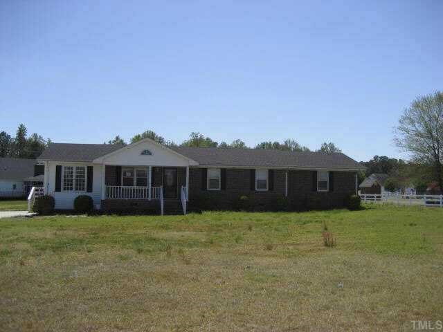 5821 Countryside Road Wilson, NC 27896 - Photo 1 of 4 a view of a house with a big yard