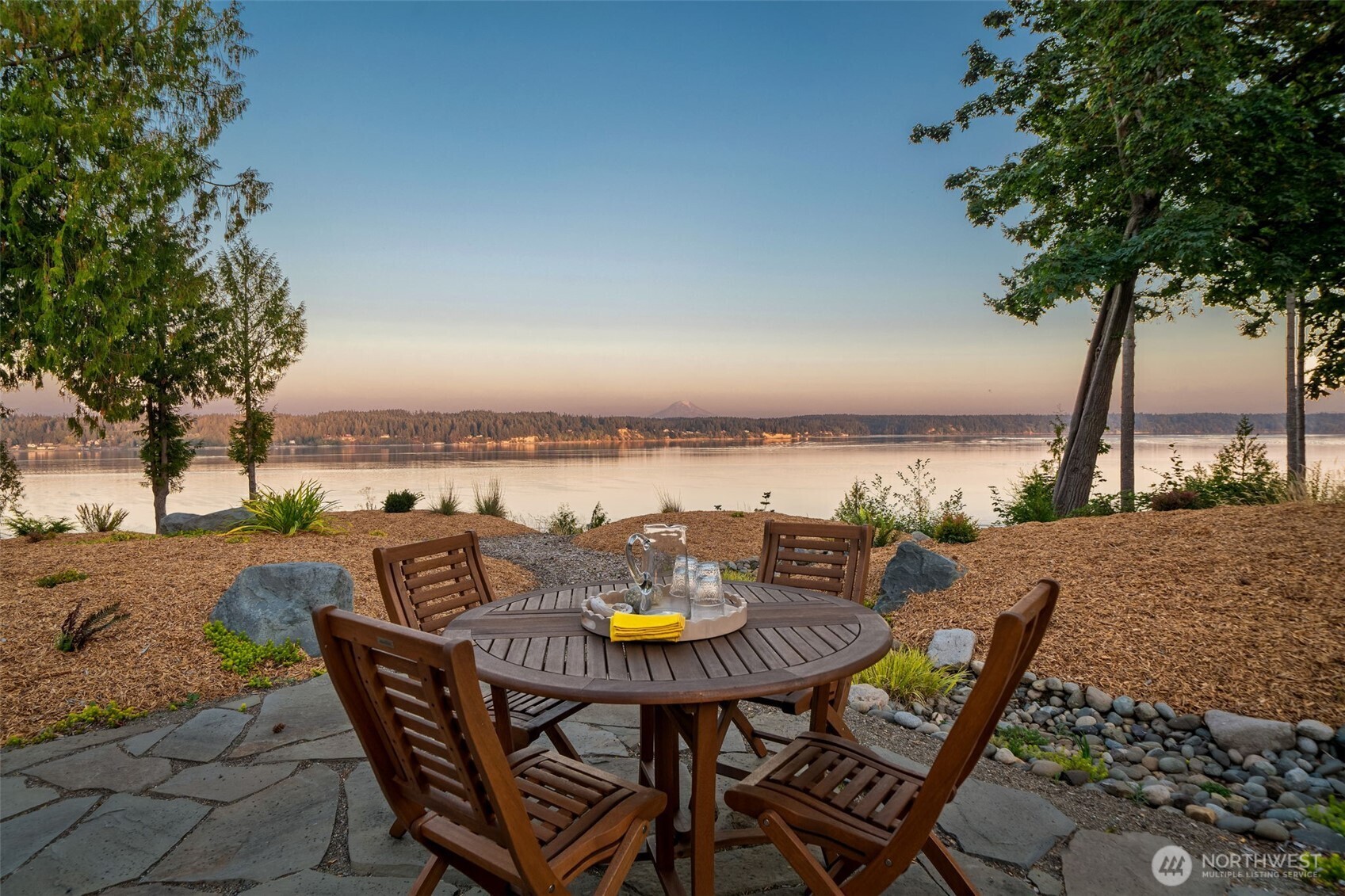 211 East Vineyard Crest Road Grapeview, WA 98546 - Photo 12 of 34 a view of a lake with furniture