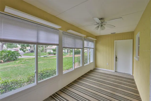 a room that has a bed and a table in it