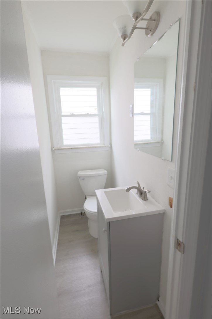 1332 South Green Road South Euclid, OH 44121 - Photo 10 of 23 Half bathroom featuring vanity and light wood finished floors