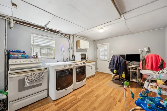 a kitchen with stainless steel appliances granite countertop a stove and cabinets