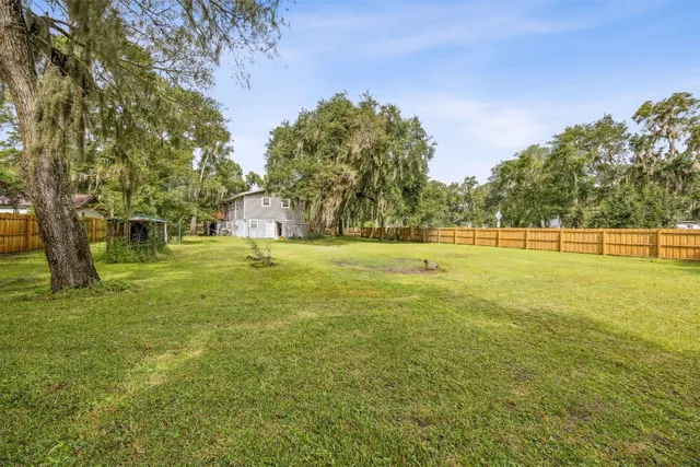 a view of outdoor space with garden and trees