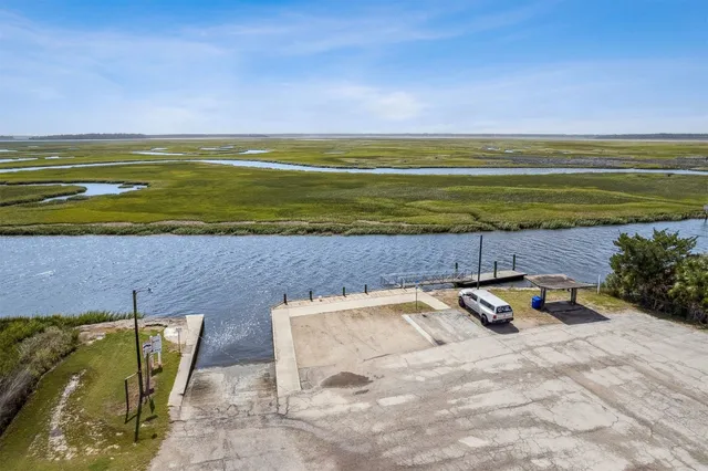 a view of a swimming pool with lounge chairs