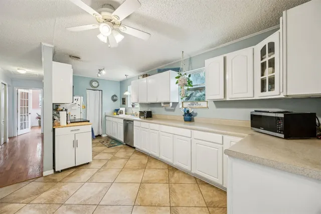 a kitchen with a stove a sink and a refrigerator