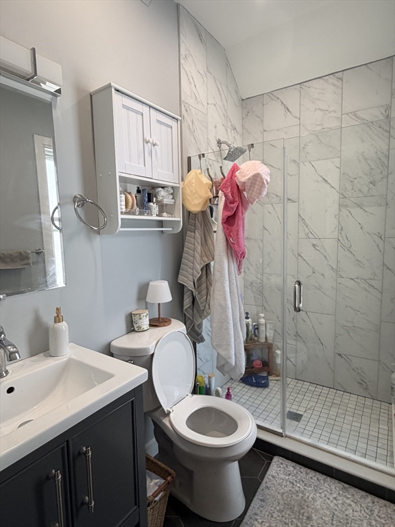 562 East 7th Street, Unit 2 Boston, MA 02127 - Photo 7 of 18 a bathroom with a sink toilet and shower