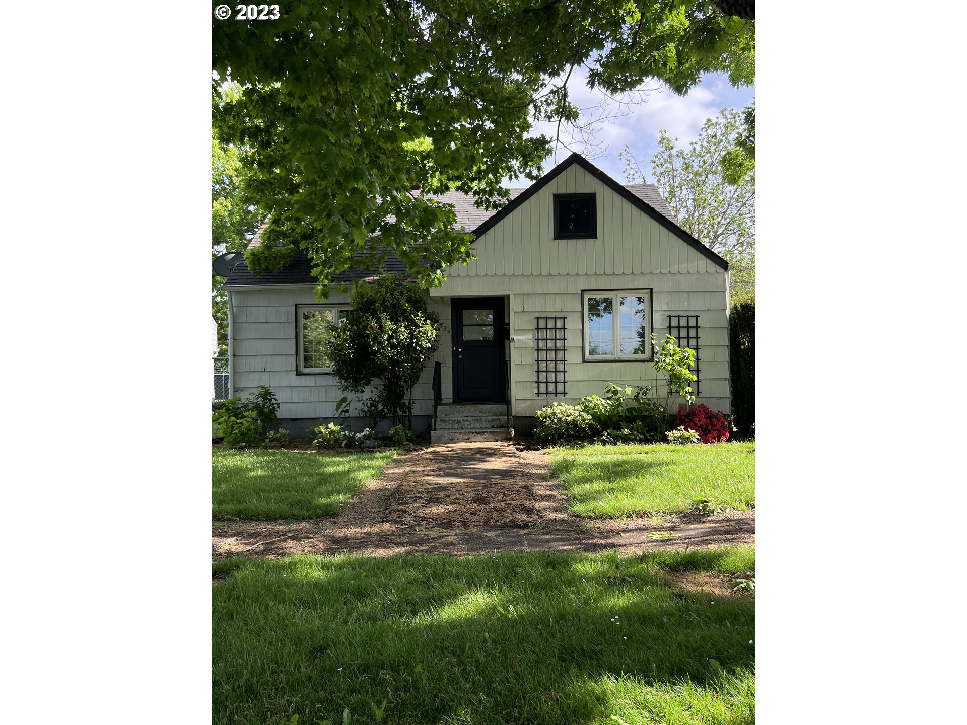 a house view with a garden space
