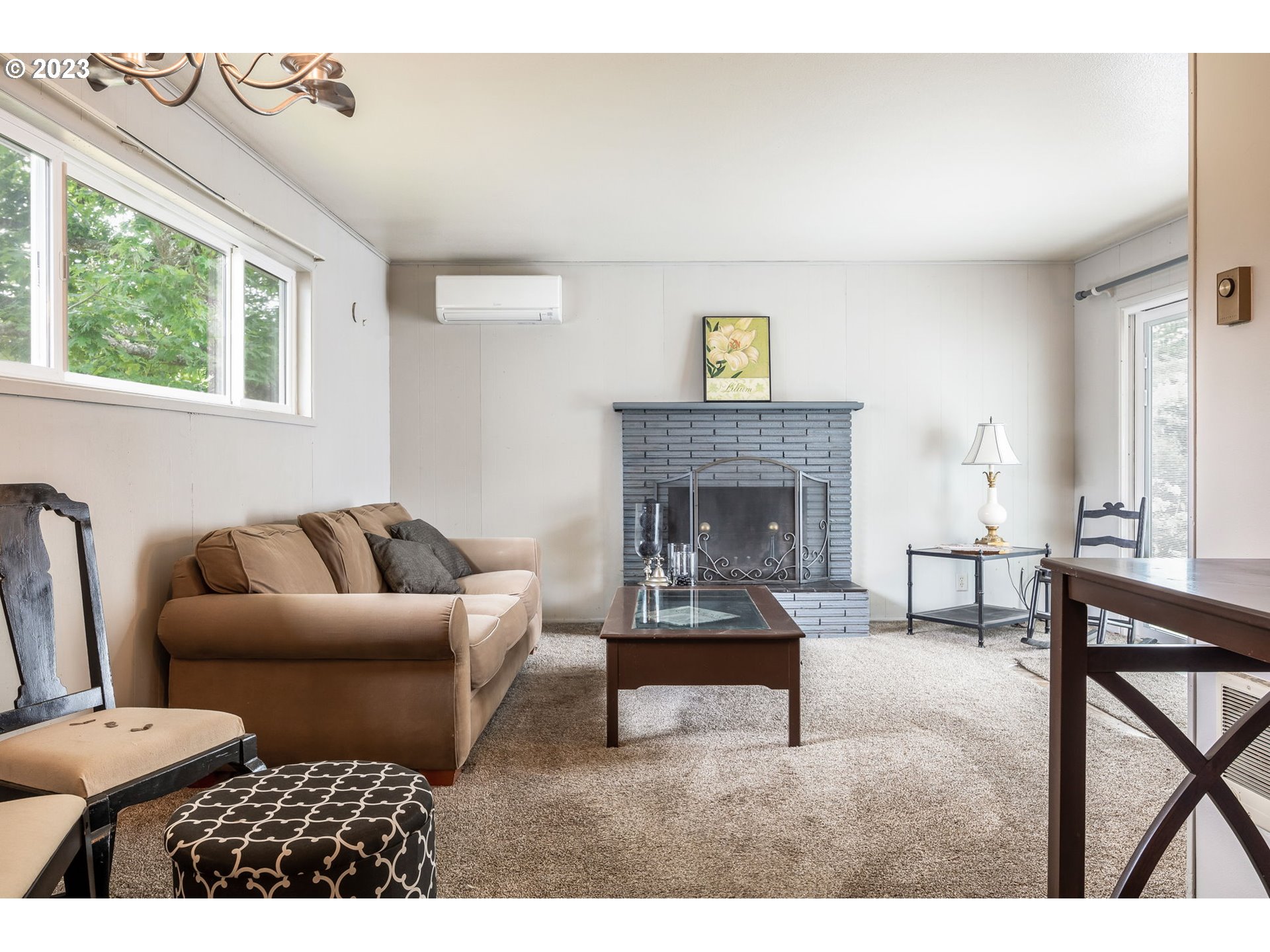 1335 B Street Springfield, OR 97477 - Photo 11 of 40 a living room with furniture and a fireplace