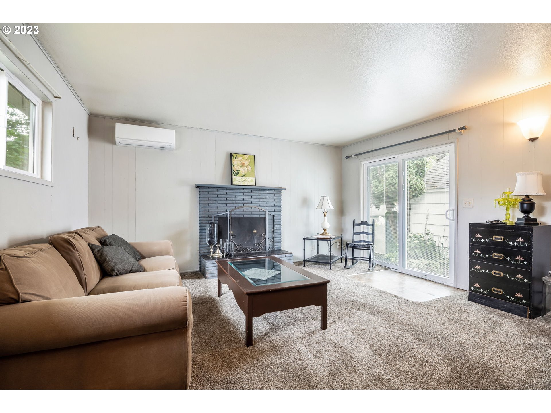 1335 B Street Springfield, OR 97477 - Photo 12 of 40 a living room with furniture and a fireplace