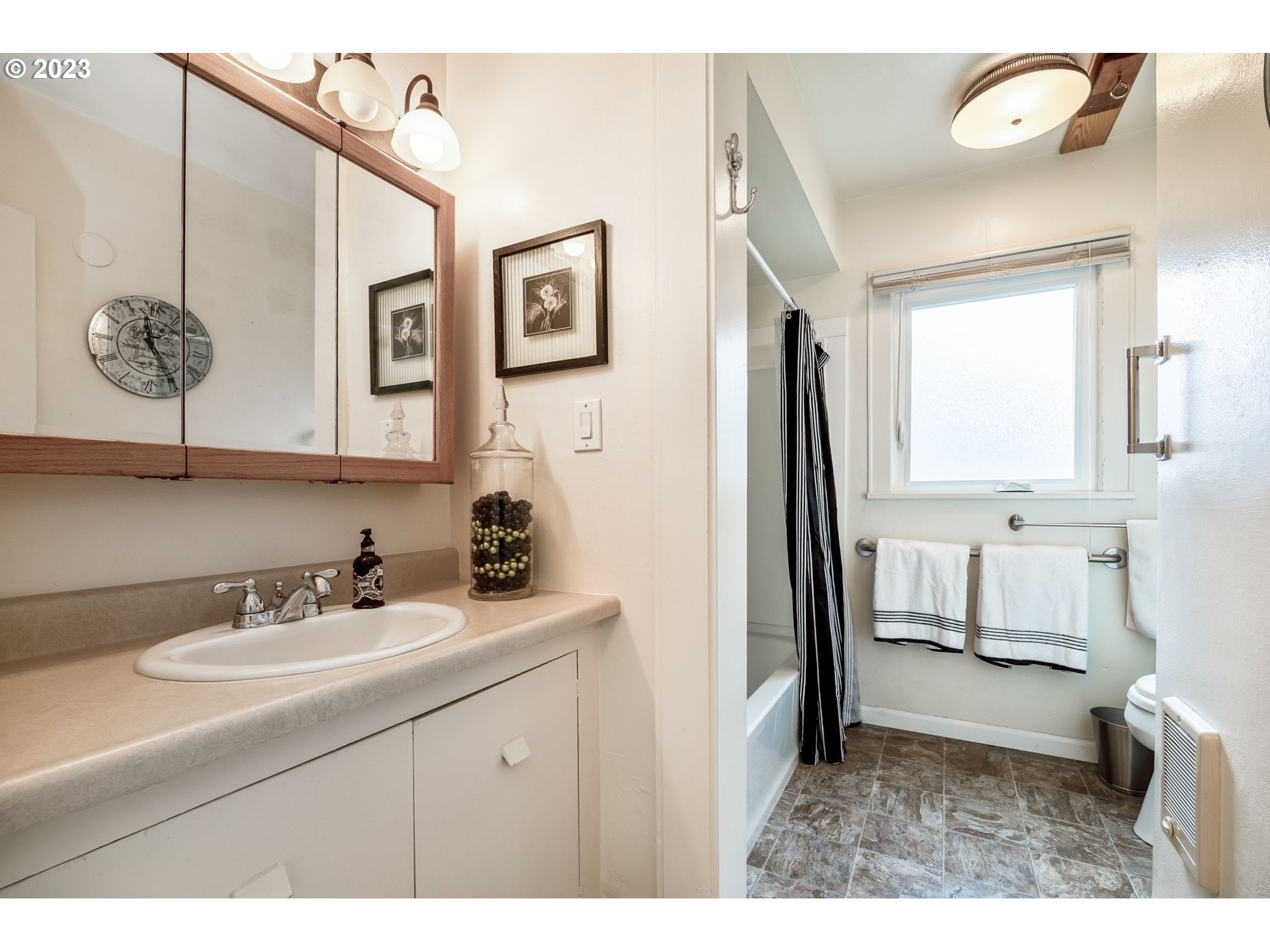 1335 B Street Springfield, OR 97477 - Photo 16 of 40 a bathroom with a sink and a mirror