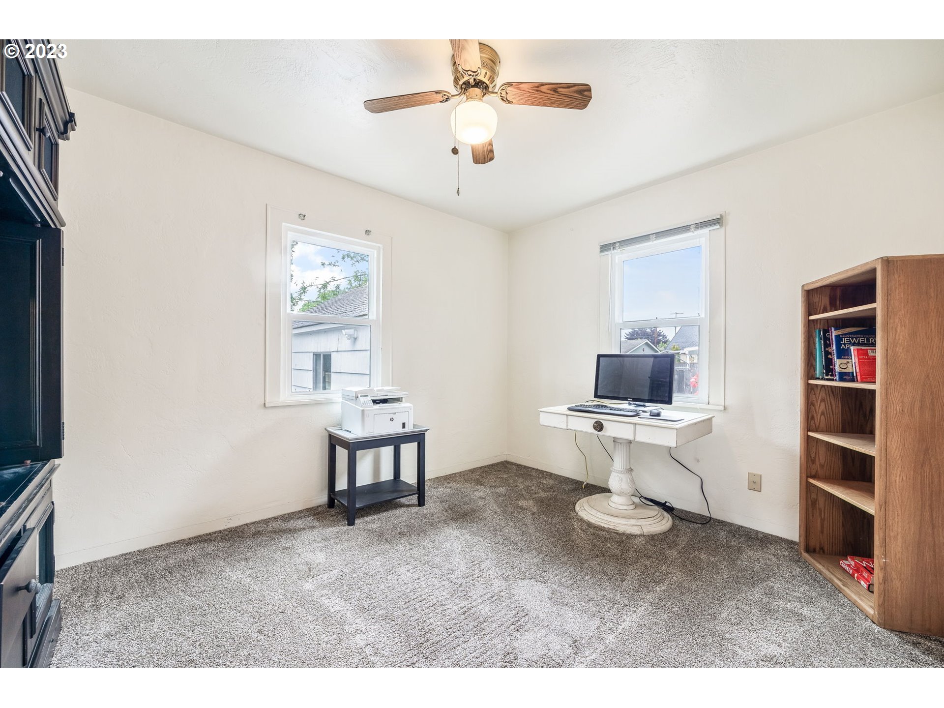 1335 B Street Springfield, OR 97477 - Photo 19 of 40 a living room with furniture a window and a flat screen tv
