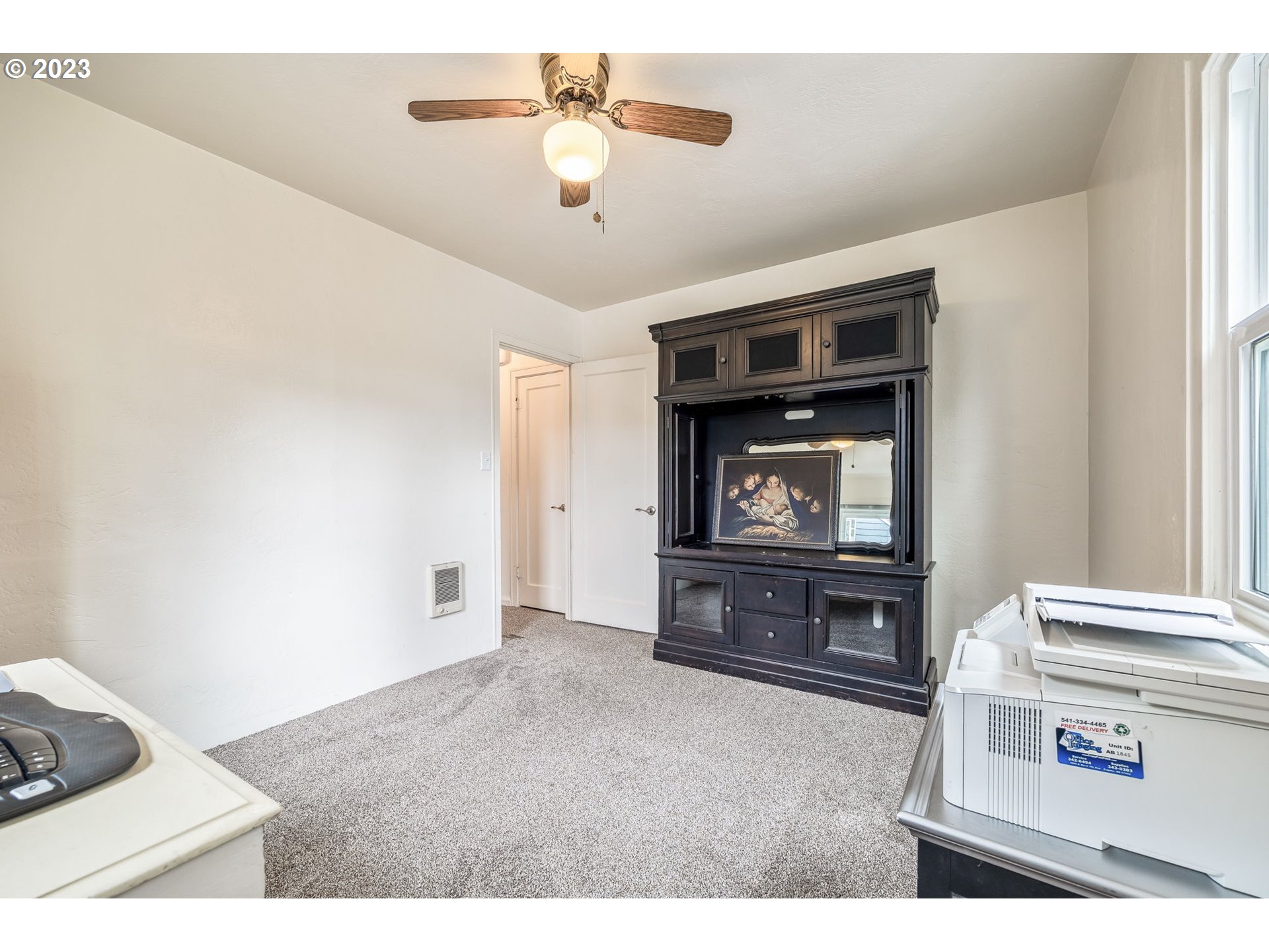 1335 B Street Springfield, OR 97477 - Photo 20 of 40 a living room with furniture and a flat screen tv