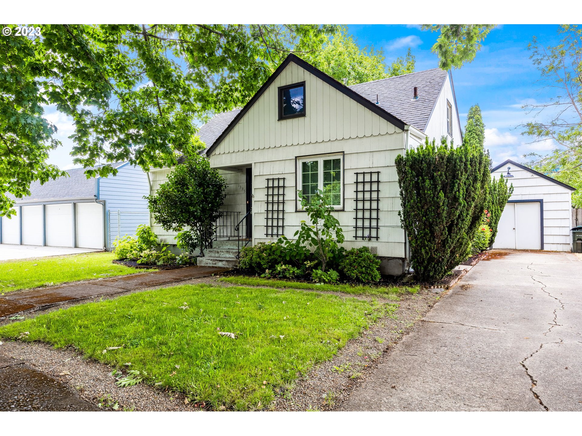 1335 B Street Springfield, OR 97477 - Photo 2 of 40 a front view of a house with a yard and garage