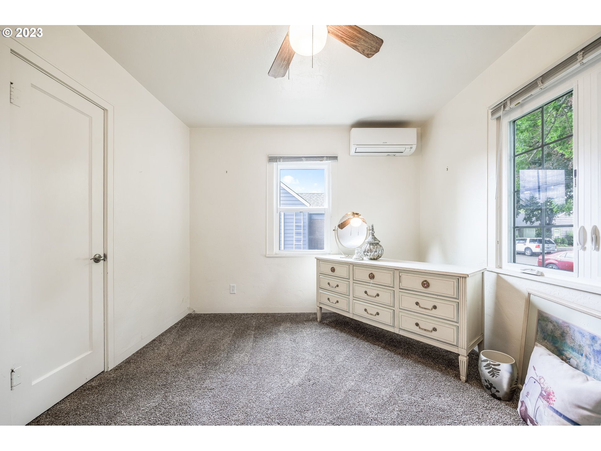 1335 B Street Springfield, OR 97477 - Photo 22 of 40 a bedroom with a baby bed baby crib and a dresser