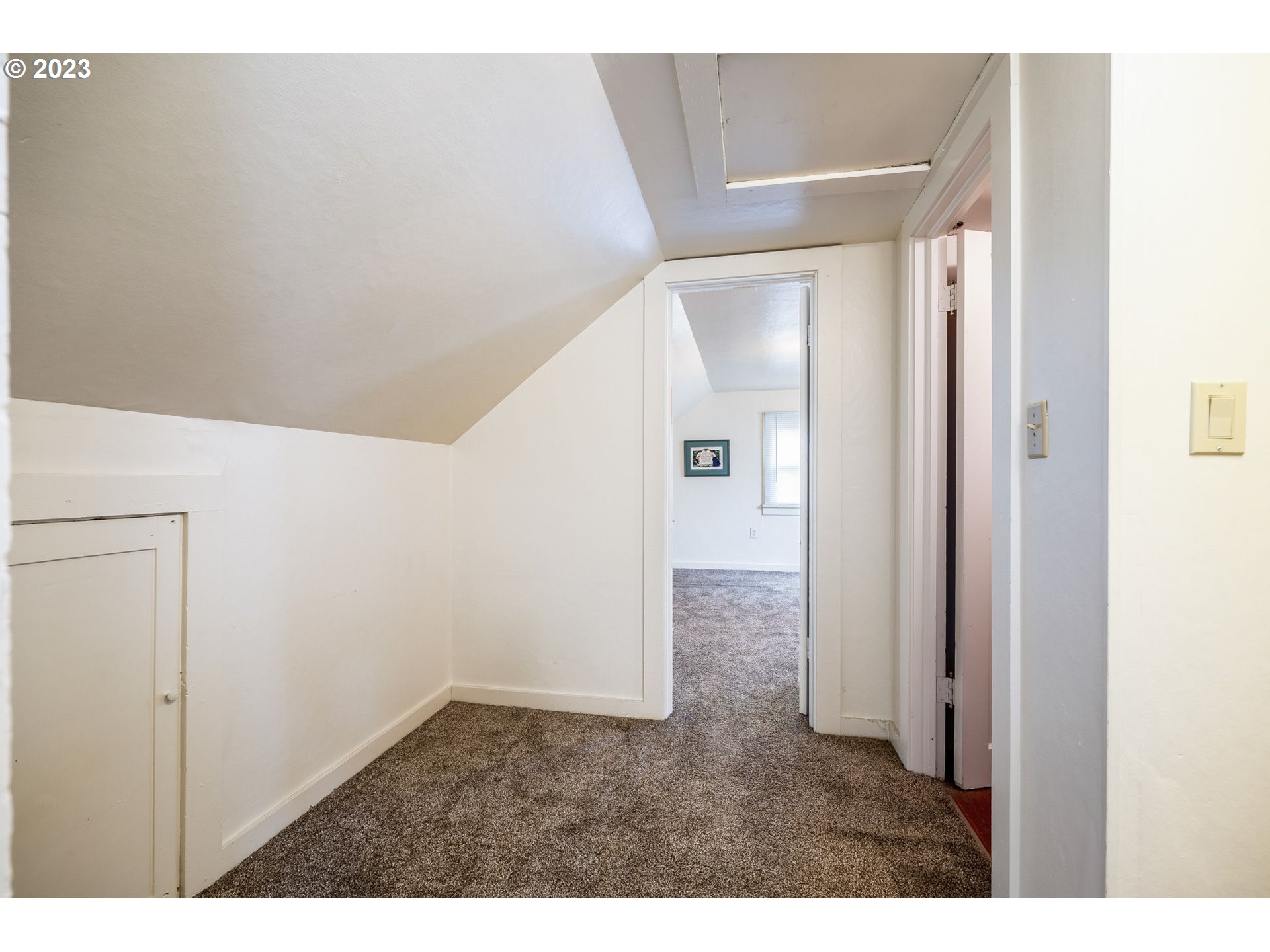 1335 B Street Springfield, OR 97477 - Photo 30 of 40 a view of a hallway with wooden floor