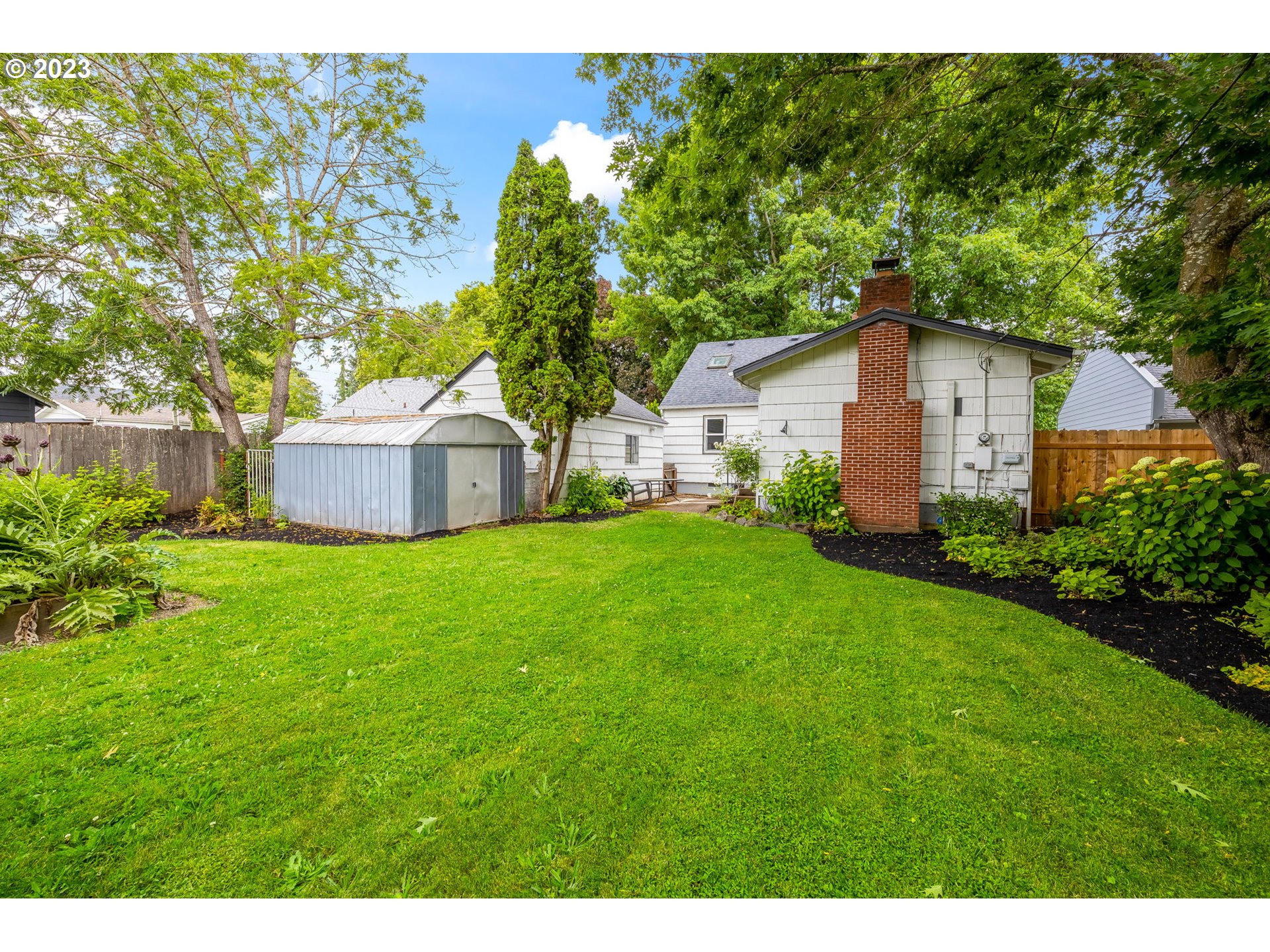 1335 B Street Springfield, OR 97477 - Photo 34 of 40 a house view with a garden space