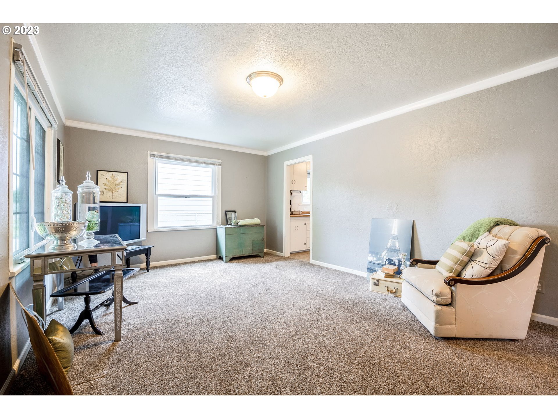 1335 B Street Springfield, OR 97477 - Photo 4 of 40 a living room with furniture and a dining room