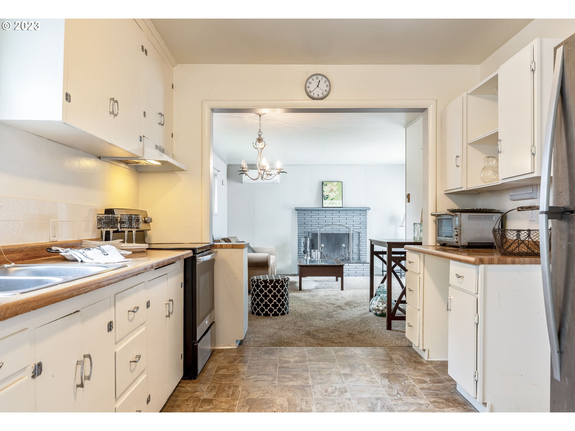1335 B Street Springfield, OR 97477 - Photo 9 of 40 a kitchen with cabinets and a stove