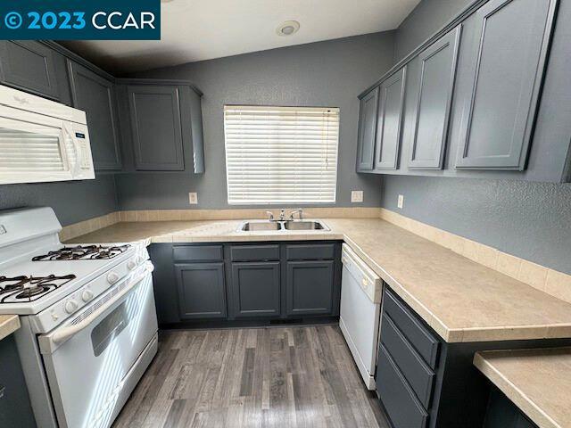 343 San Marcus Drive Vallejo, CA 94590 - Photo 7 of 20 a kitchen with stainless steel appliances granite countertop a sink stove and cabinets
