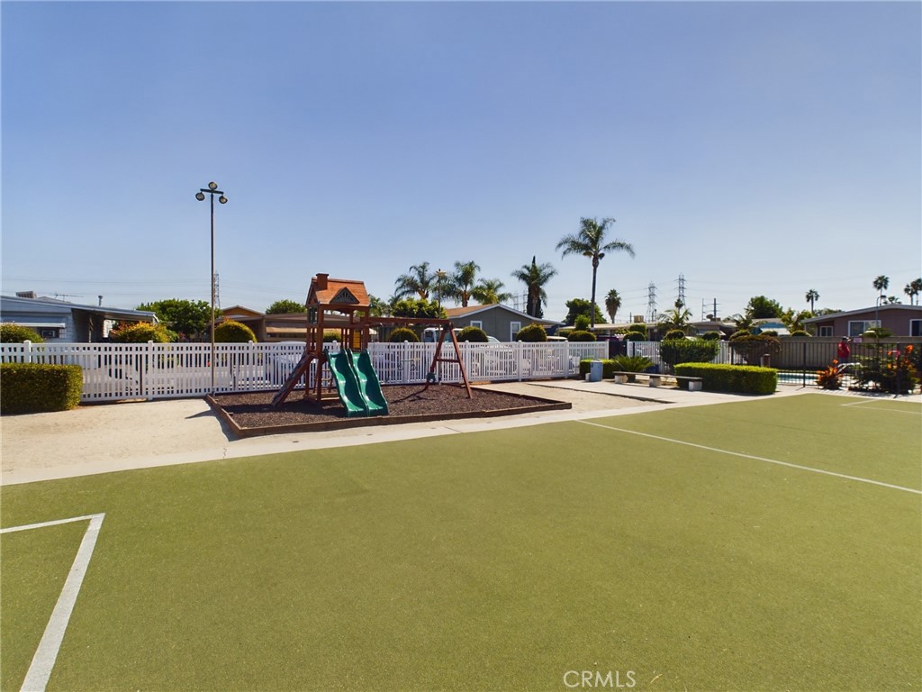 16600 Orange Avenue, Unit 55 Paramount, CA 90723 - Photo 18 of 18 a view of a swimming pool with outdoor seating