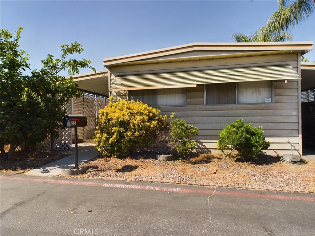 16600 Orange Avenue, Unit 55 Paramount, CA 90723 - Photo 2 of 18 a front view of house with yard