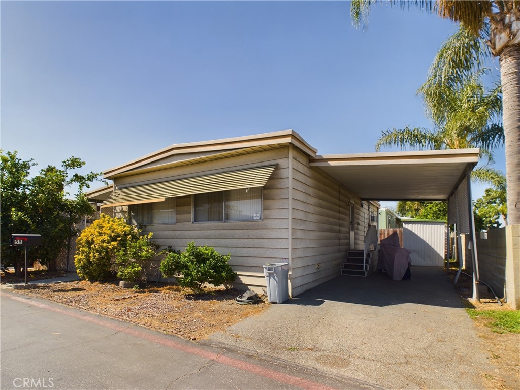 16600 Orange Avenue, Unit 55 Paramount, CA 90723 - Photo 3 of 18 a view of house with yard and sitting area