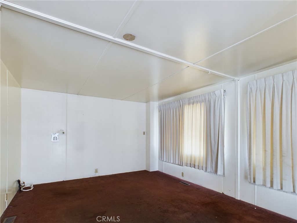 16600 Orange Avenue, Unit 55 Paramount, CA 90723 - Photo 5 of 18 an empty room with windows