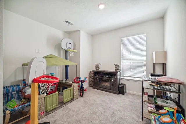 a living room with lots of furniture and a flat screen tv