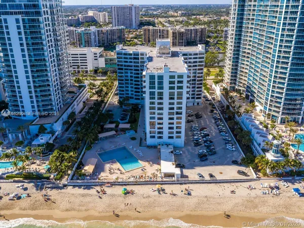a view of swimming pool with seating area