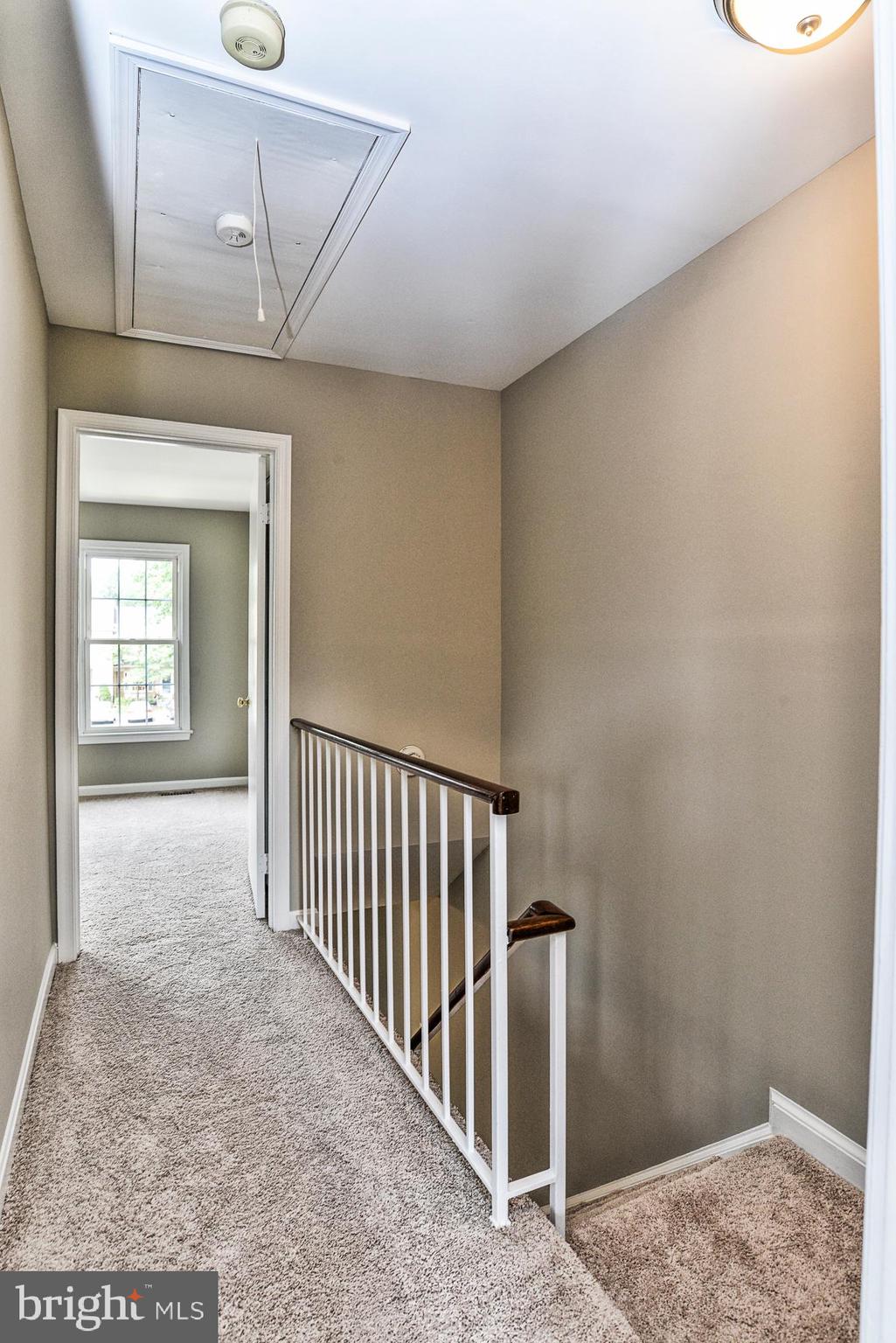 10287 Latney Road Fairfax, VA 22032 - Photo 23 of 36 Upper Level Hallway with Pull Down Attic Stairs