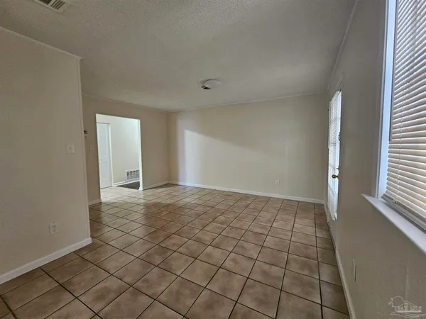 a view of an empty room and window