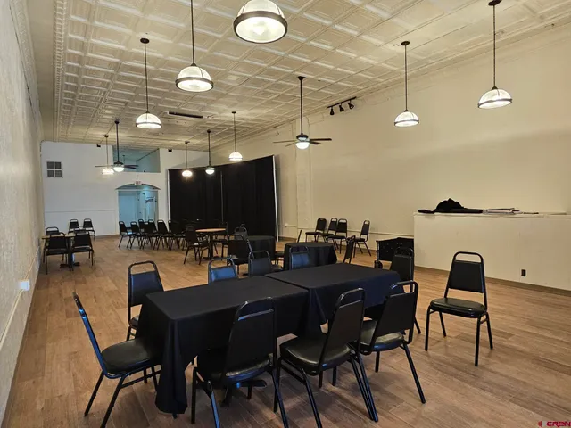 a view of hotel room with stairs and a couch