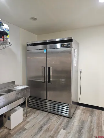 a bathroom with a glass shower door