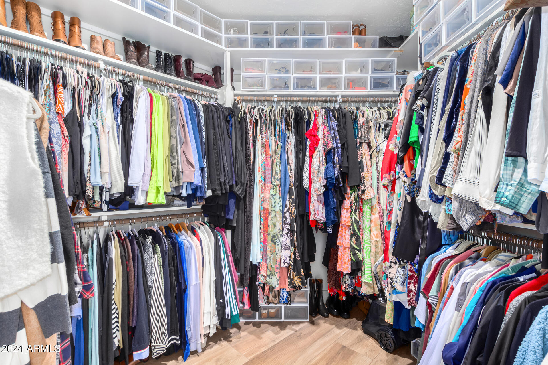 9446 Romping Road Carefree, AZ 85377 - Photo 104 of 119 a view of walk in closet with clothes