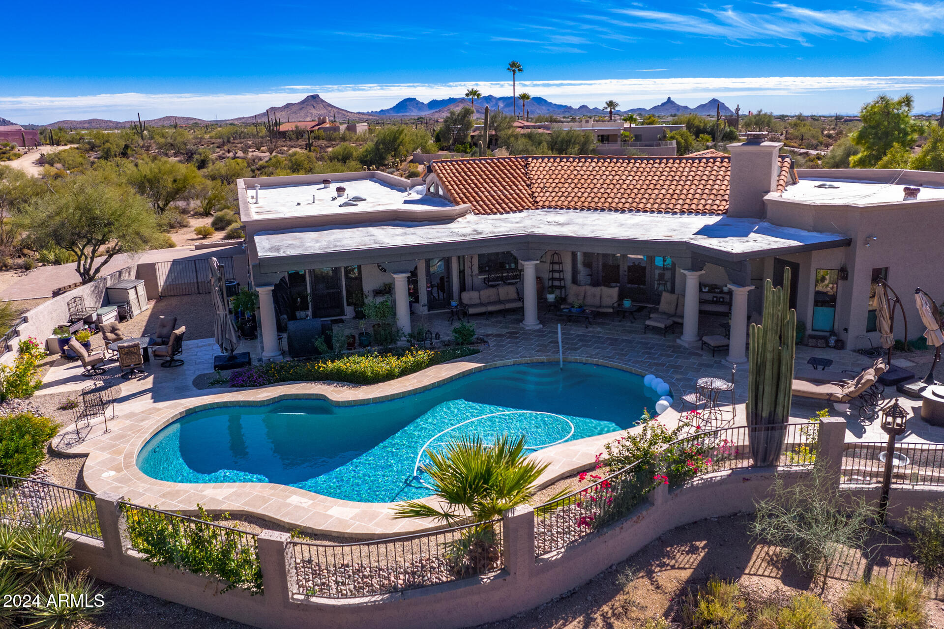 9446 Romping Road Carefree, AZ 85377 - Photo 116 of 119 a view of a swimming pool with a patio