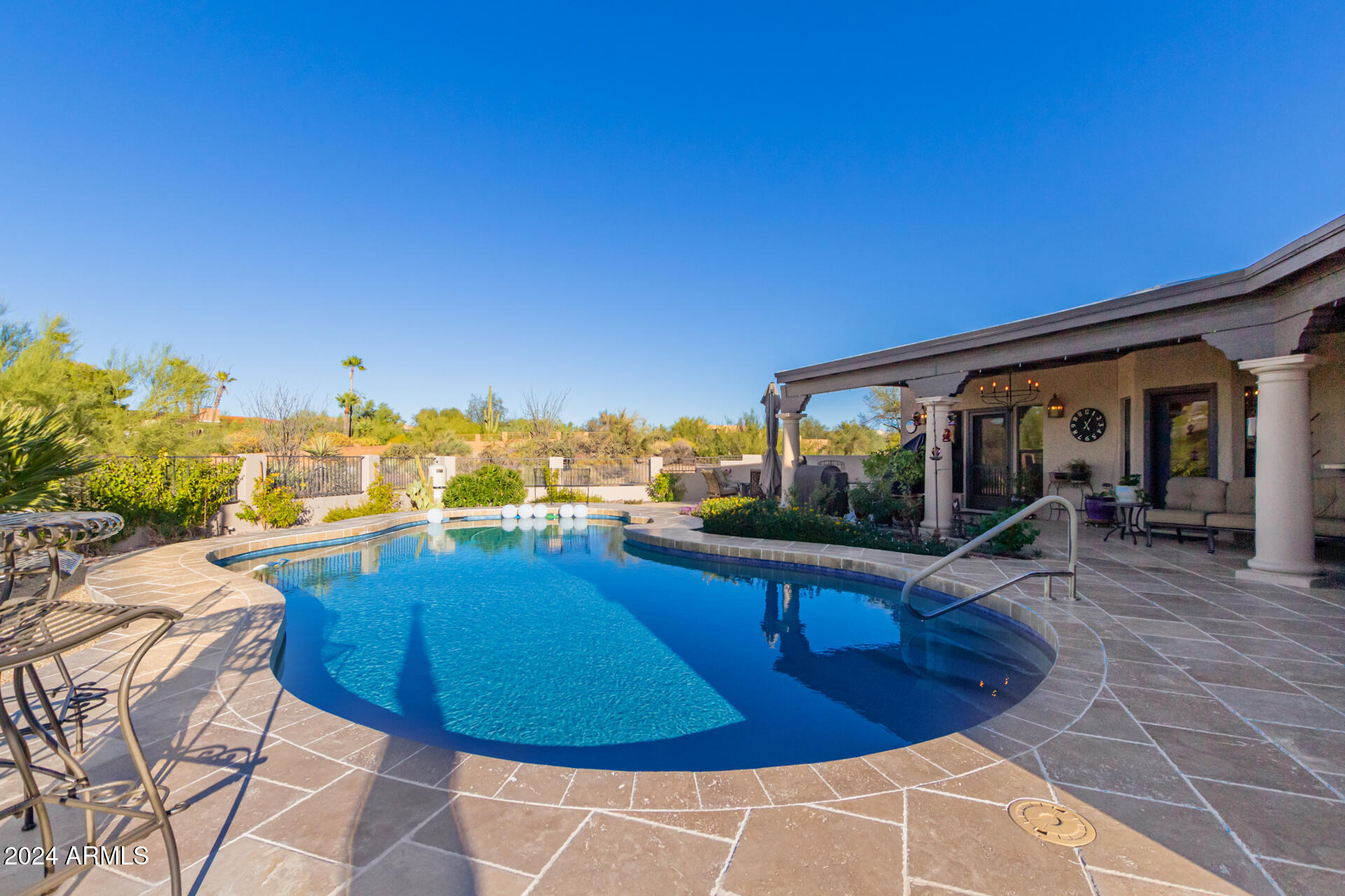 9446 Romping Road Carefree, AZ 85377 - Photo 79 of 119 a view of a swimming pool with lounge chair