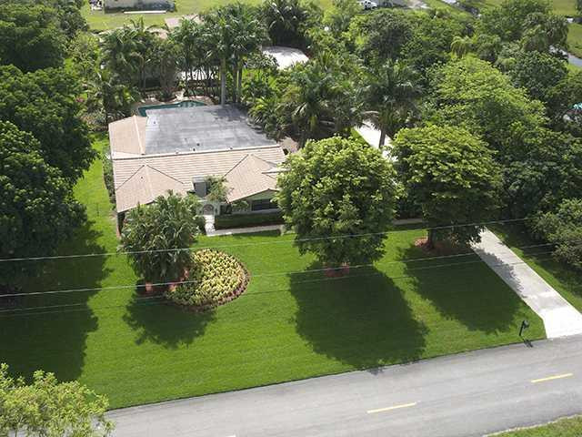 4920 Southwest 166th Avenue Southwest Ranches, FL 33331 - Photo 1 of 23 a view of a garden from a lake