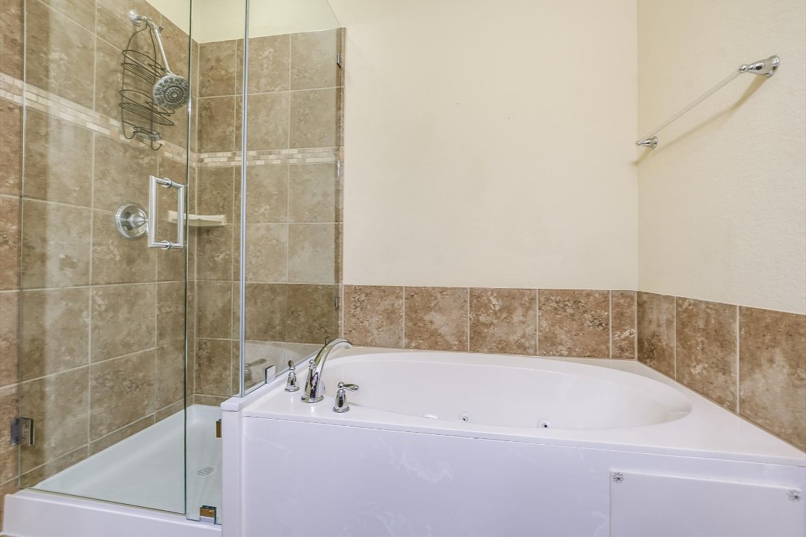 14001 Avery Ranch Boulevard, Unit 2104 Austin, TX 78717 - Photo 14 of 21 a bathroom with a bathtub and shower