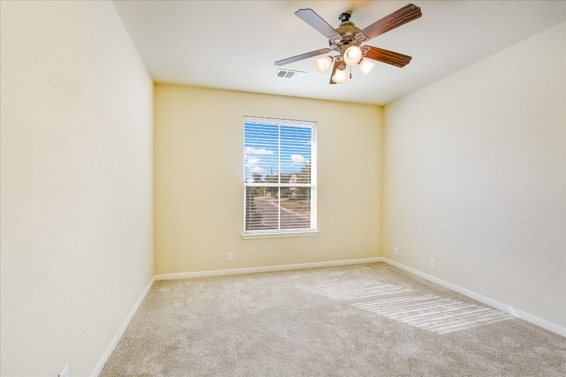 14001 Avery Ranch Boulevard, Unit 2104 Austin, TX 78717 - Photo 15 of 21 an empty room with a window and a fan